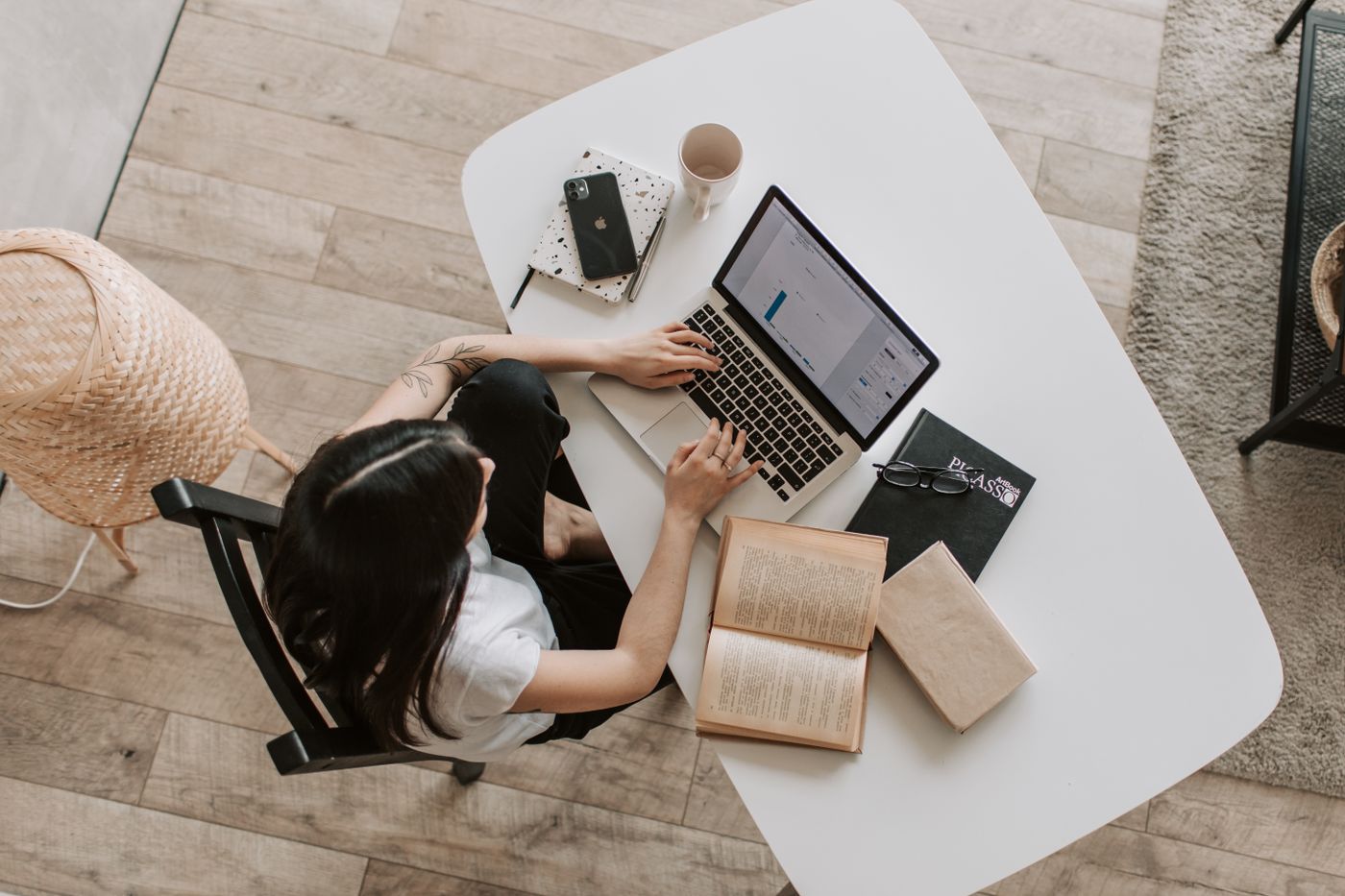 Person managing laptop and phone remotely with MDM
